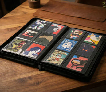 A display of artist-designed Paperwallet Micro Wallets organized neatly in a binder, perfect for collectors who love to protect, organize, and show off their unique Tyvek designs just like rare trading cards.