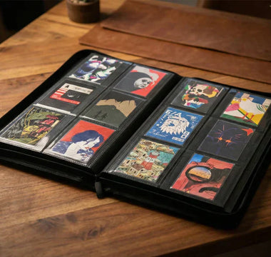 A display of artist-designed Paperwallet Micro Wallets organized neatly in a binder, perfect for collectors who love to protect, organize, and show off their unique Tyvek designs just like rare trading cards.