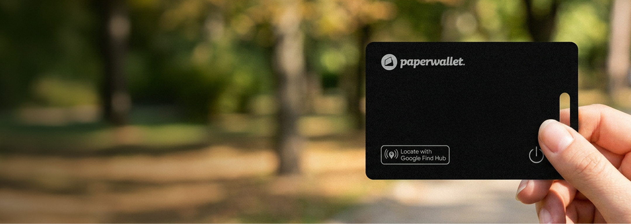 Paperwallet Finder Card held in front of a blurred outdoor background